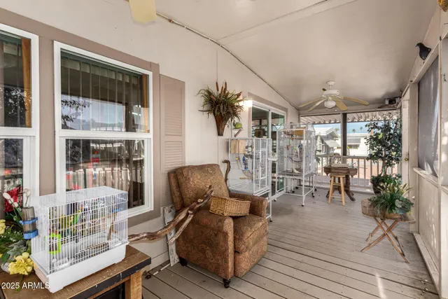 a view of a balcony with wooden floor