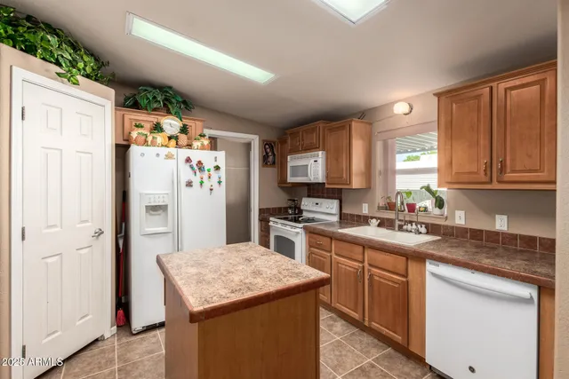 a kitchen with a sink stove and refrigerator