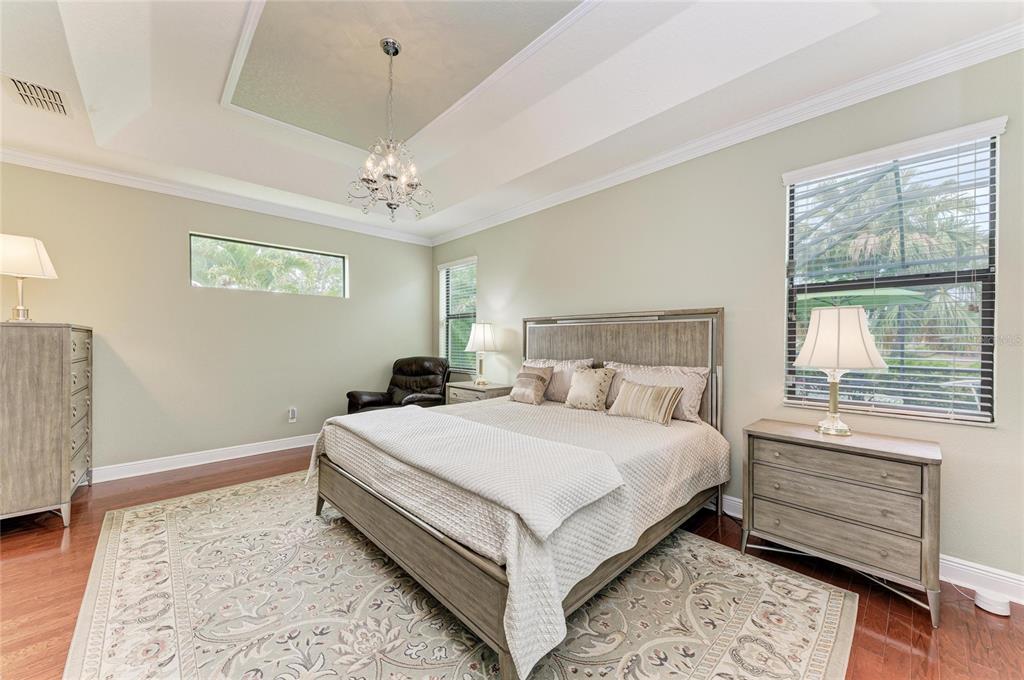 302 Cockle Shell Loop Apollo Beach, FL 33572 - Photo 33 of 75 a bedroom with a large bed and a window