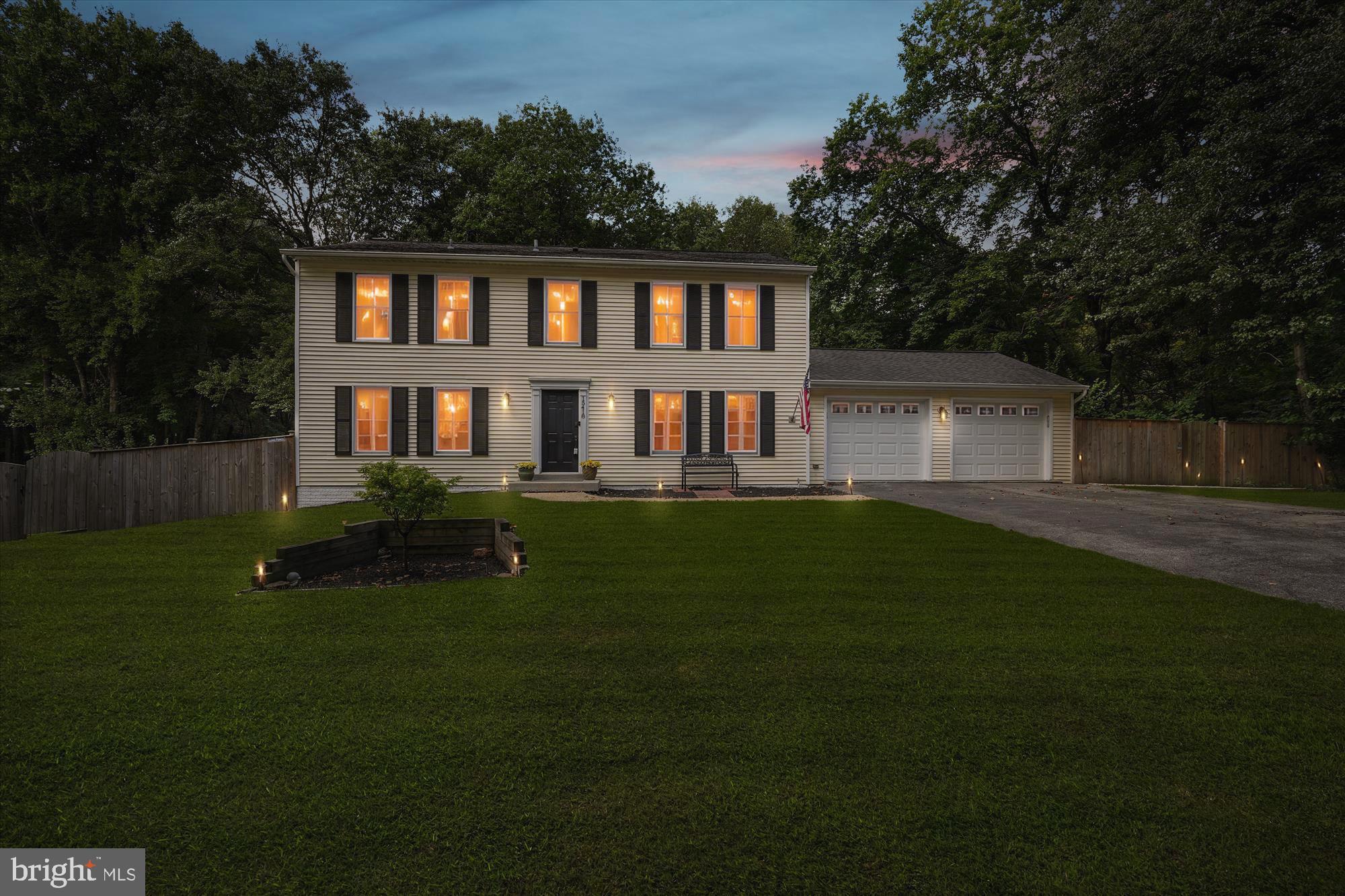 15418 Peach Orchard Road Silver Spring, MD 20905 - Photo 1 of 47 Charming home illuminated at twilight.