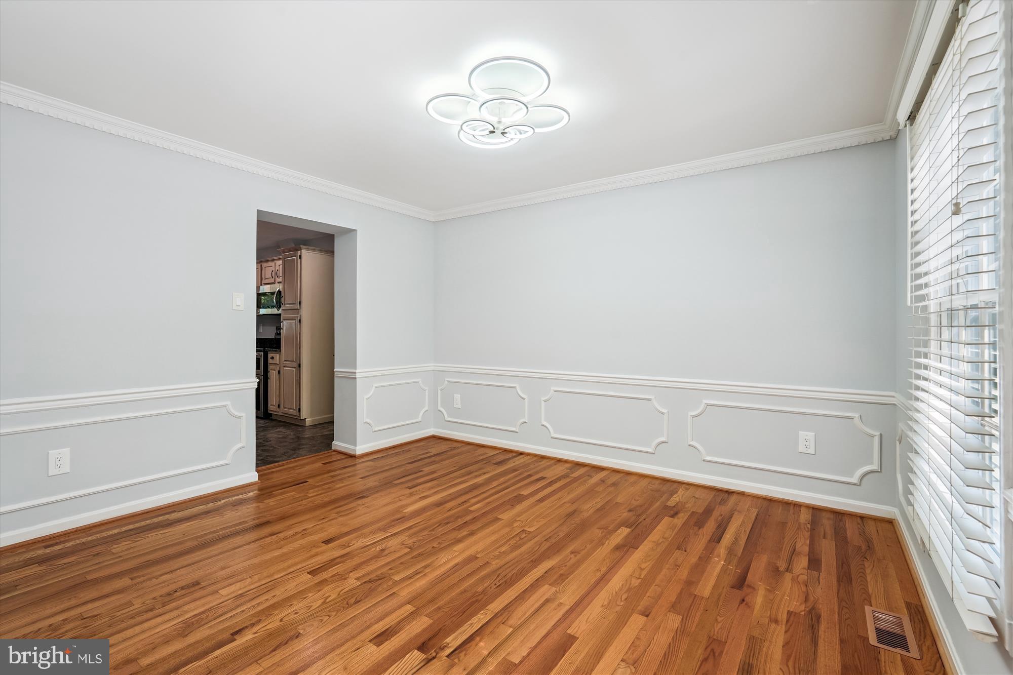 15418 Peach Orchard Road Silver Spring, MD 20905 - Photo 12 of 47 Formal dining room with kitchen access.