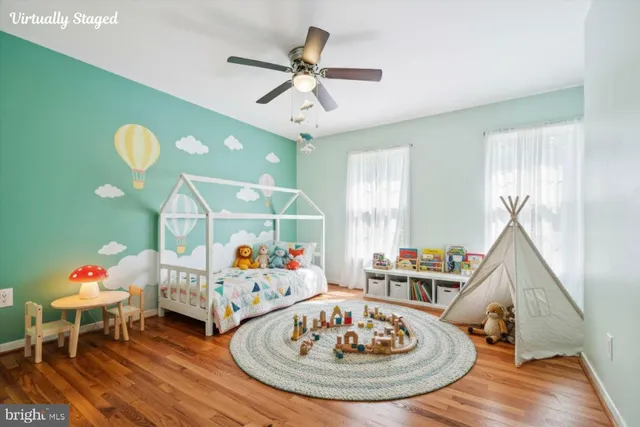 a living room with furniture and a dining table
