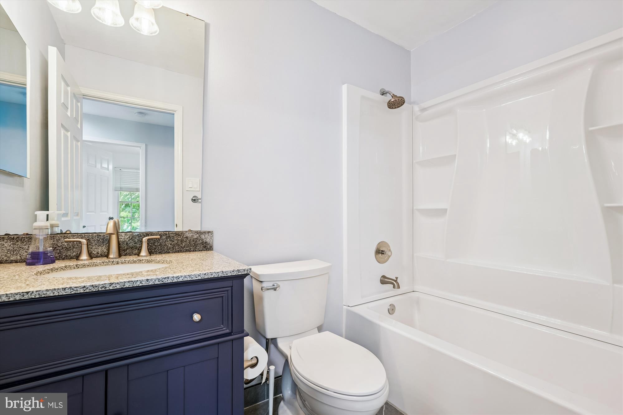 15418 Peach Orchard Road Silver Spring, MD 20905 - Photo 29 of 47 Modern bathroom with sleek finishes (upper level).