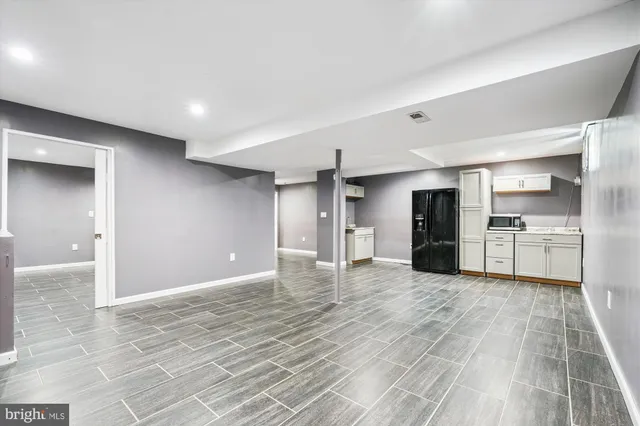 a view of a kitchen with a sink and a stove top oven
