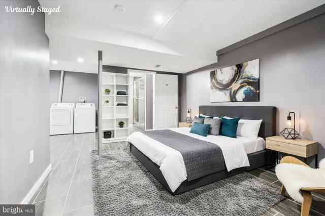 a spacious bedroom with a bed and a couch