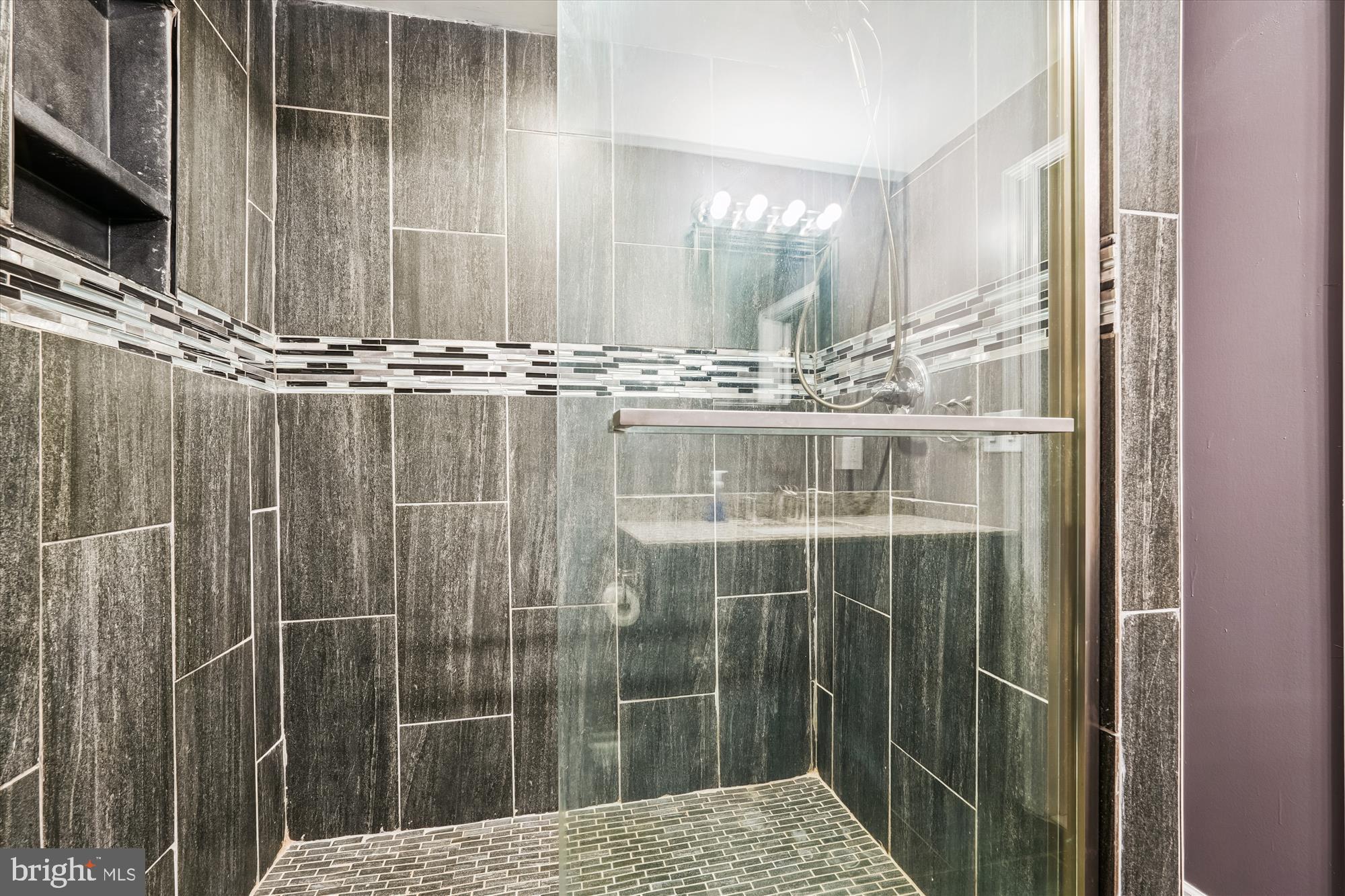 15418 Peach Orchard Road Silver Spring, MD 20905 - Photo 38 of 47 Shower with elegant tile design.