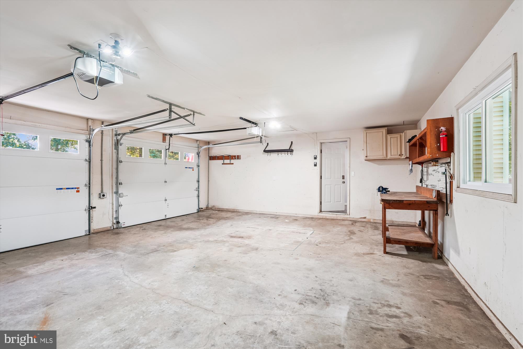 15418 Peach Orchard Road Silver Spring, MD 20905 - Photo 39 of 47 Spacious garage with ample natural light.