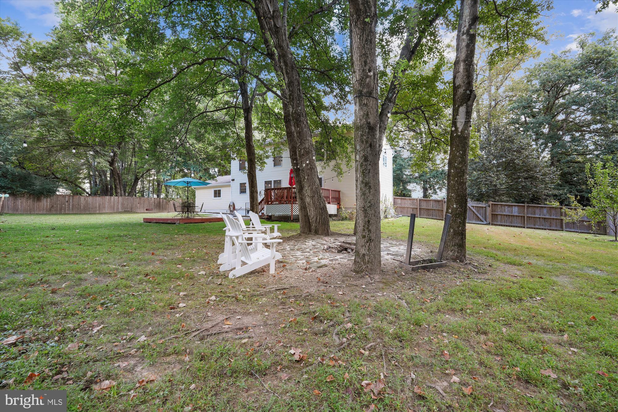 15418 Peach Orchard Road Silver Spring, MD 20905 - Photo 45 of 47 Tranquil backyard retreat with shaded seating.