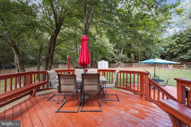 a view of deck with wooden floor and outdoor seating