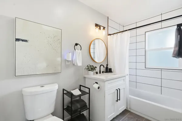 a bathroom with a toilet a sink and a bathtub