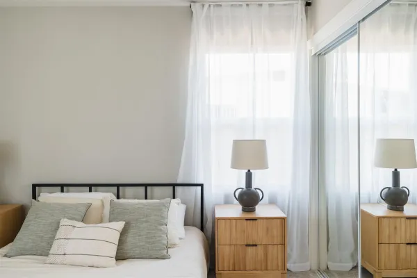 a living room with furniture and a lamp