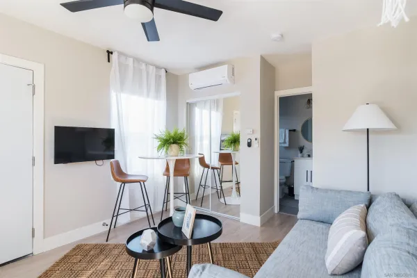 a view of a livingroom with furniture and a flat screen tv