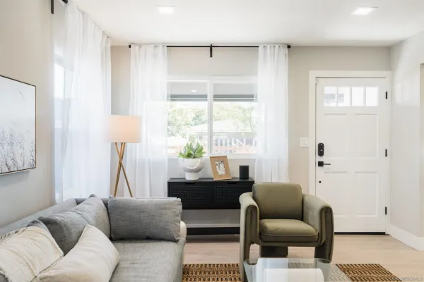 a living room with furniture and a window