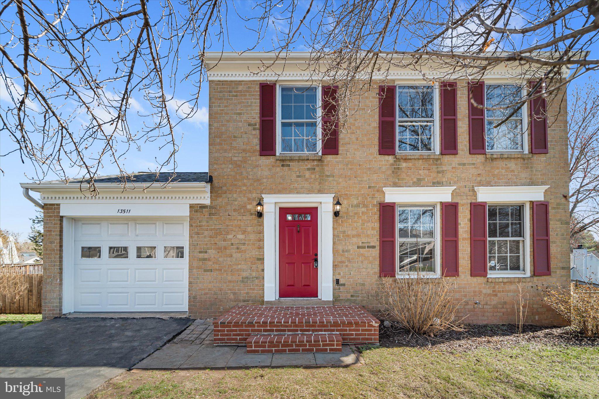 13511 Chevy Chase Court Chantilly, VA 20151 - Photo 1 of 57 a front view of a house with a yard