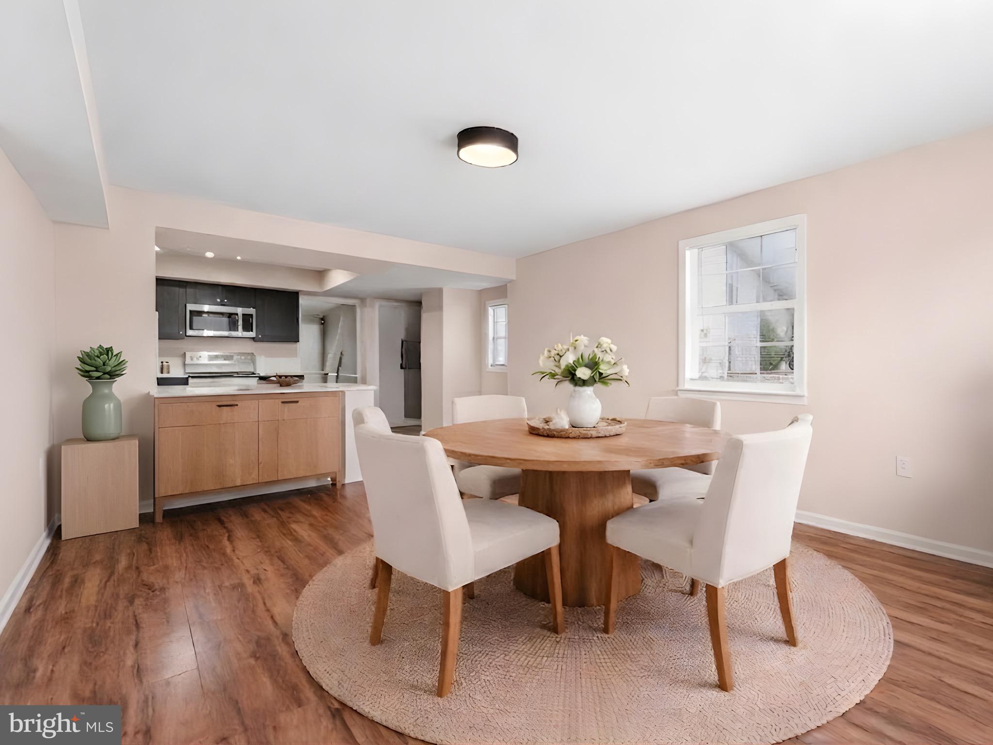 13511 Chevy Chase Court Chantilly, VA 20151 - Photo 14 of 57 a view of a dining room with furniture and wooden floor