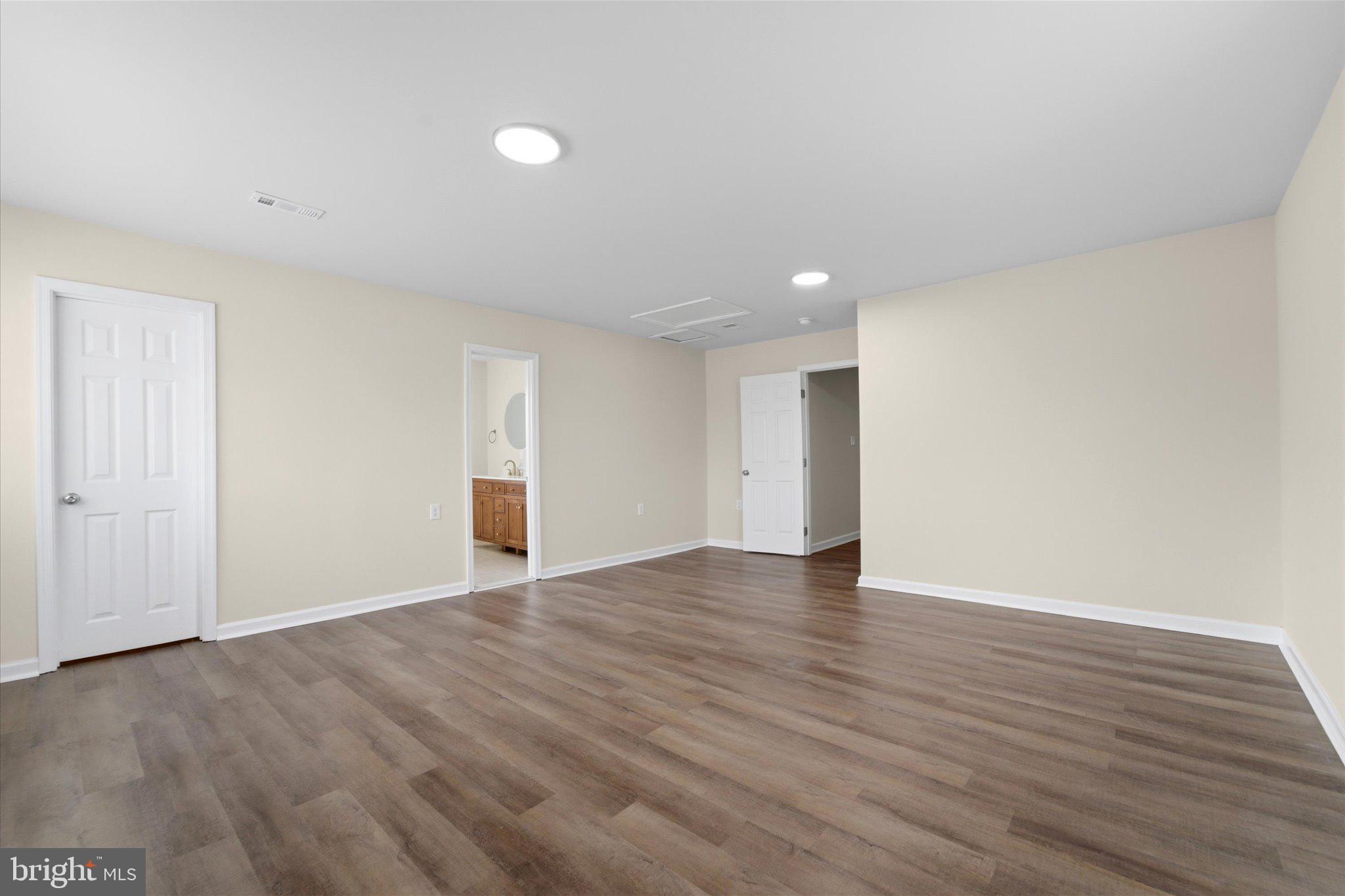 13511 Chevy Chase Court Chantilly, VA 20151 - Photo 20 of 57 a view of an empty room with wooden floor