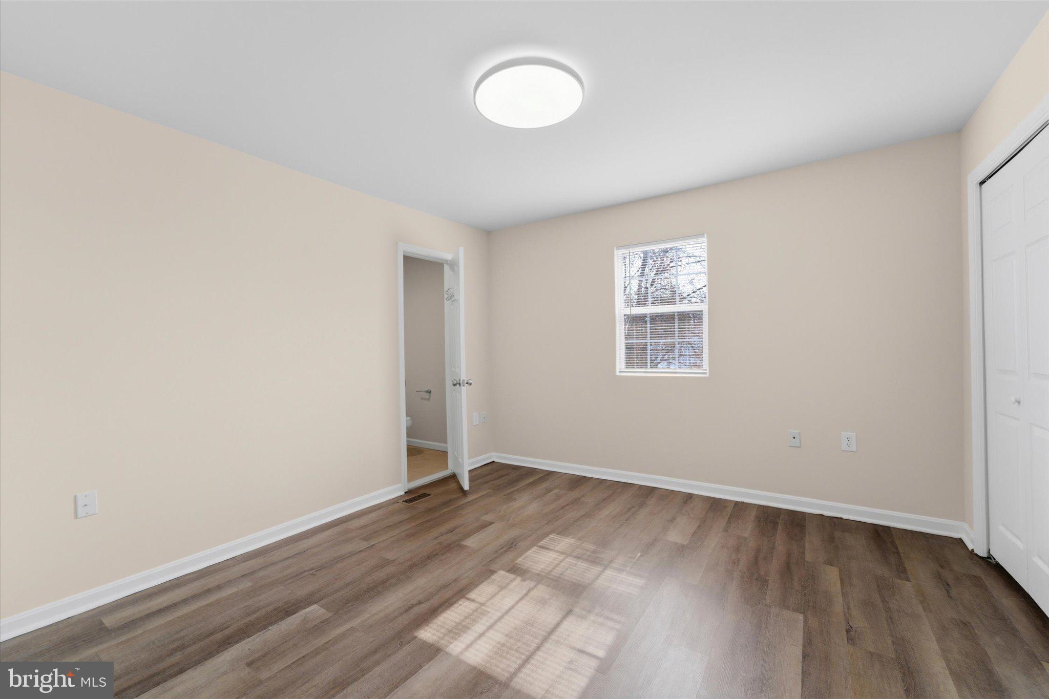 13511 Chevy Chase Court Chantilly, VA 20151 - Photo 25 of 57 an empty room with wooden floor and windows