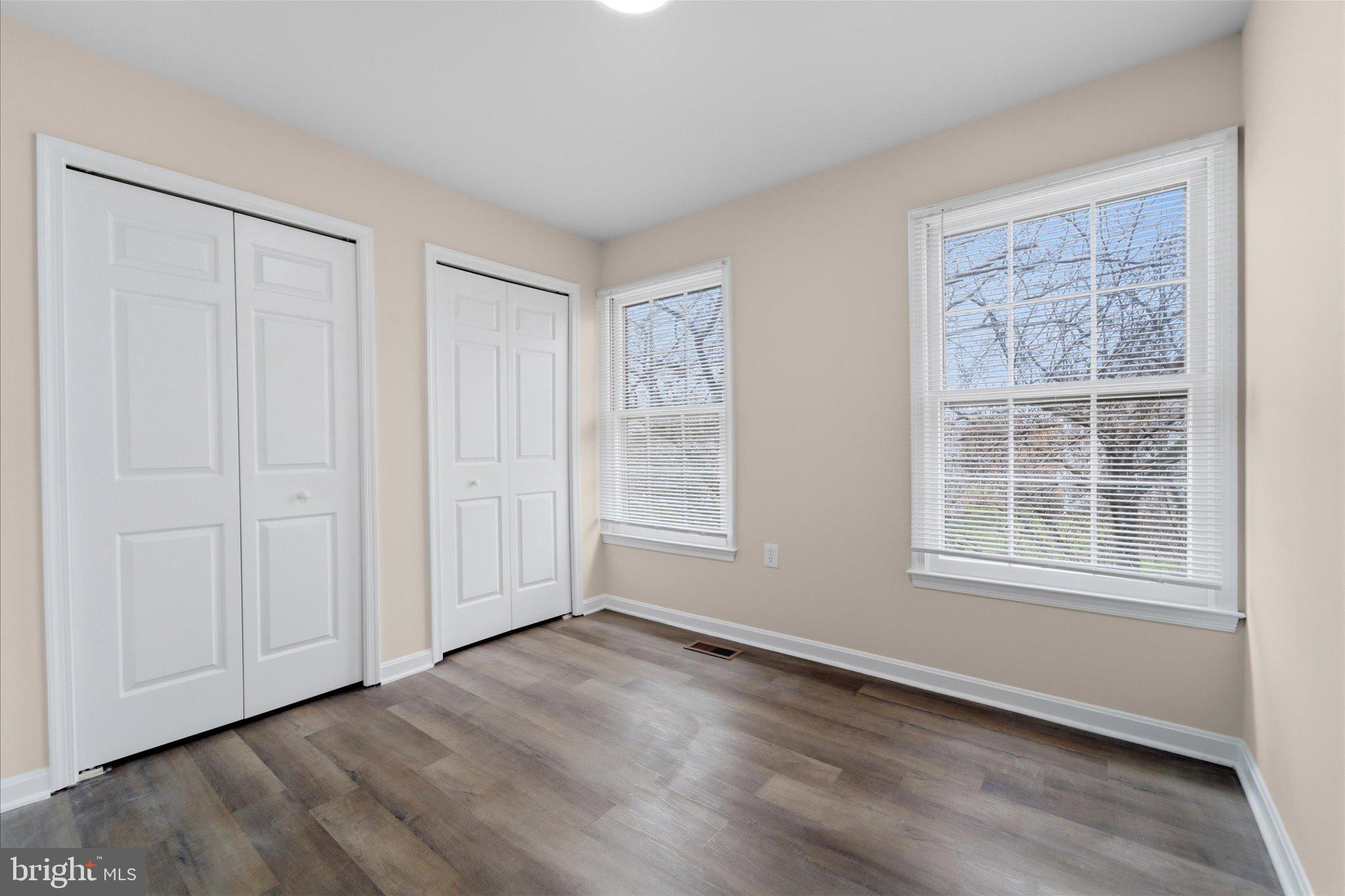 13511 Chevy Chase Court Chantilly, VA 20151 - Photo 28 of 57 an empty room with wooden floor and windows