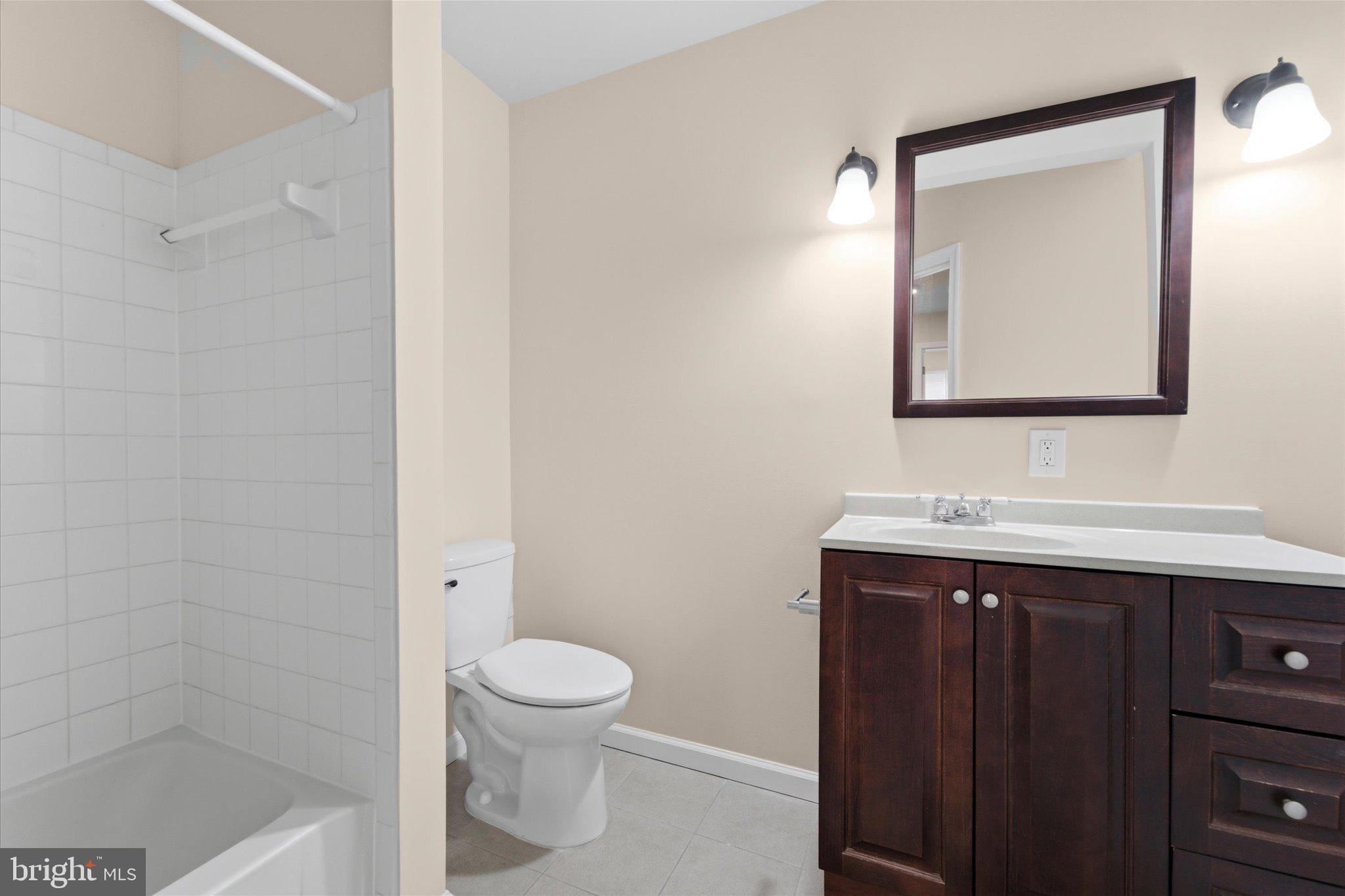 13511 Chevy Chase Court Chantilly, VA 20151 - Photo 30 of 57 a bathroom with a sink a toilet and shower