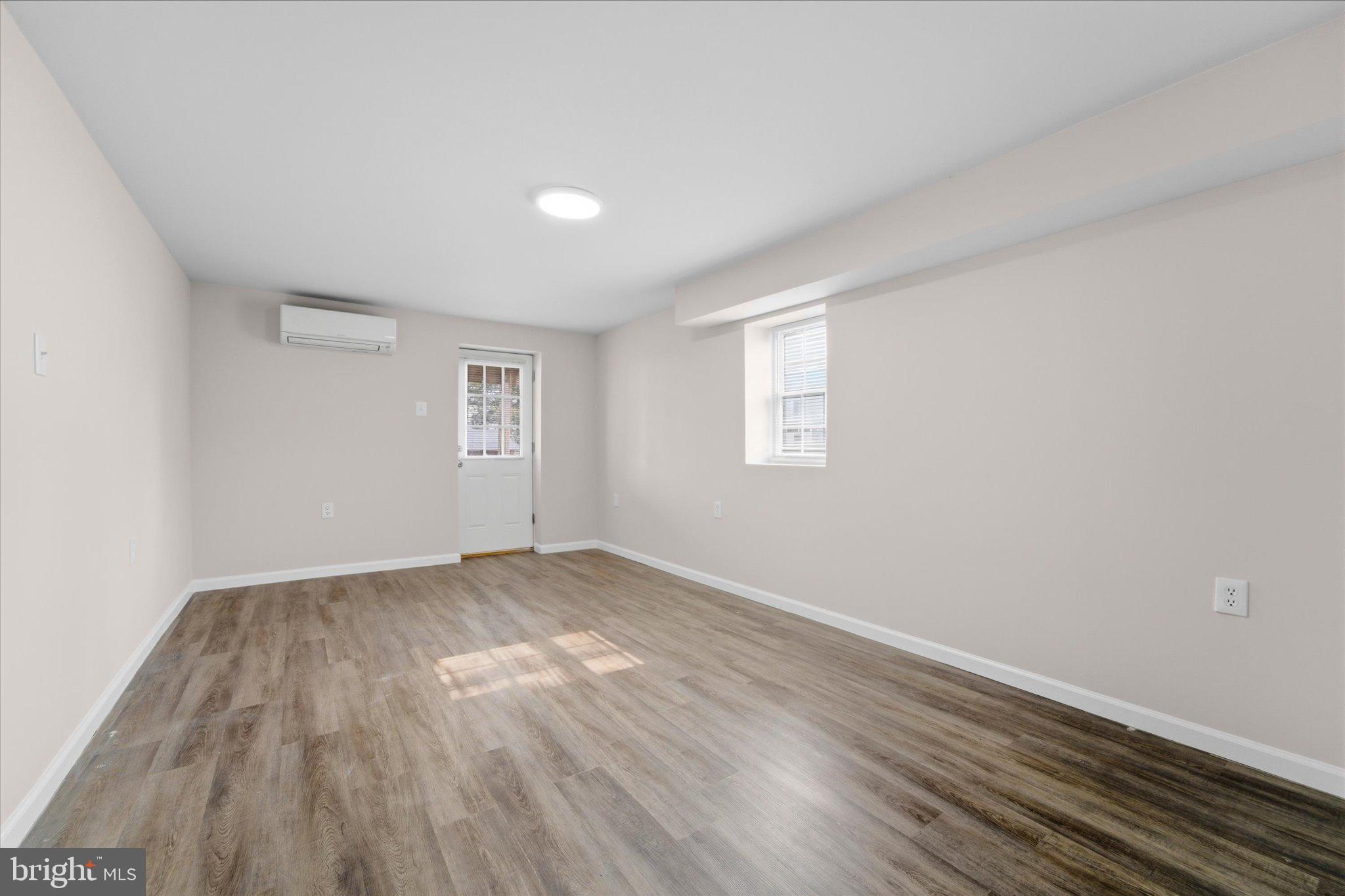 13511 Chevy Chase Court Chantilly, VA 20151 - Photo 35 of 57 an empty room with wooden floor and windows