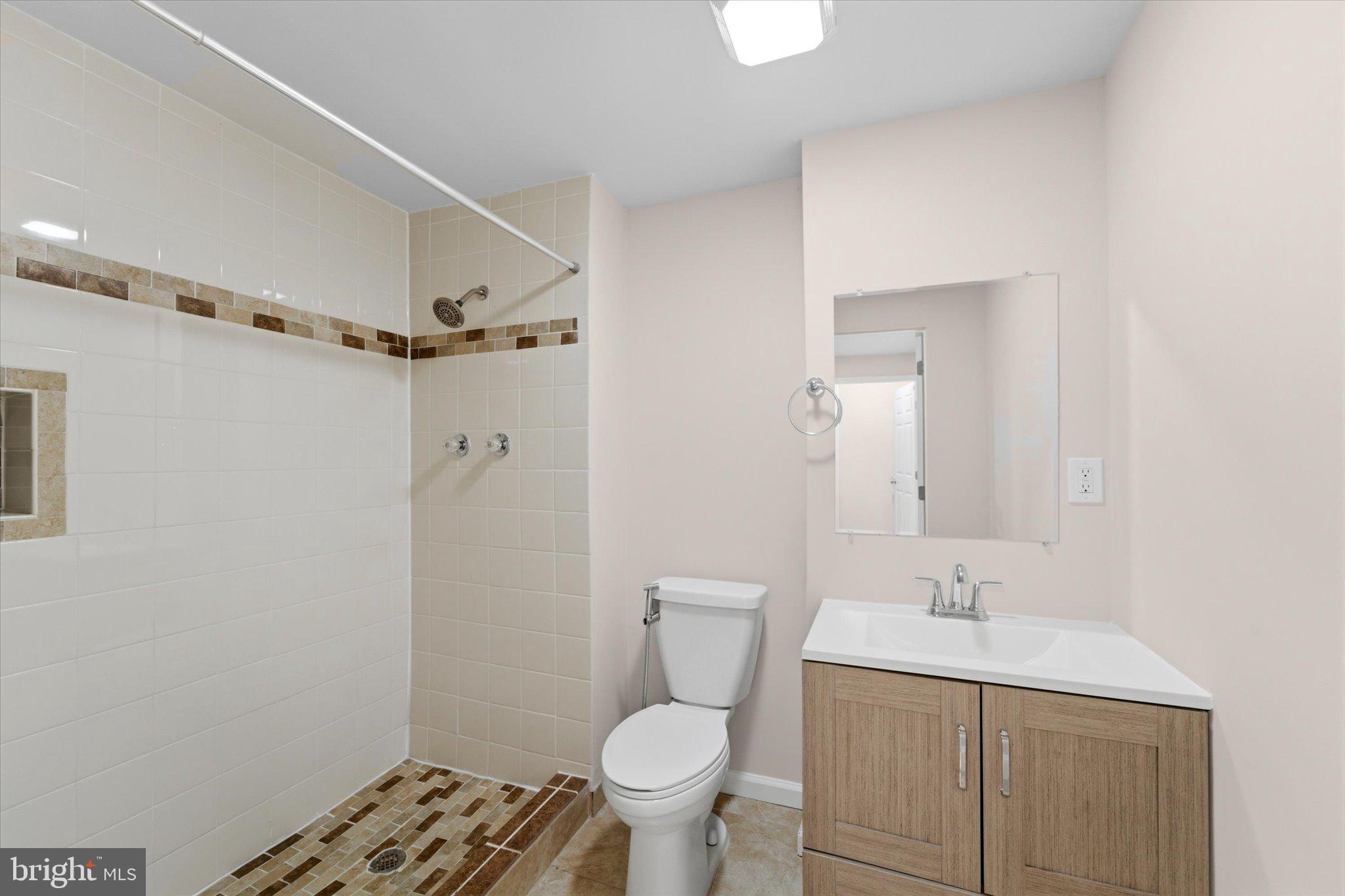 13511 Chevy Chase Court Chantilly, VA 20151 - Photo 42 of 57 a bathroom with a sink a toilet and shower