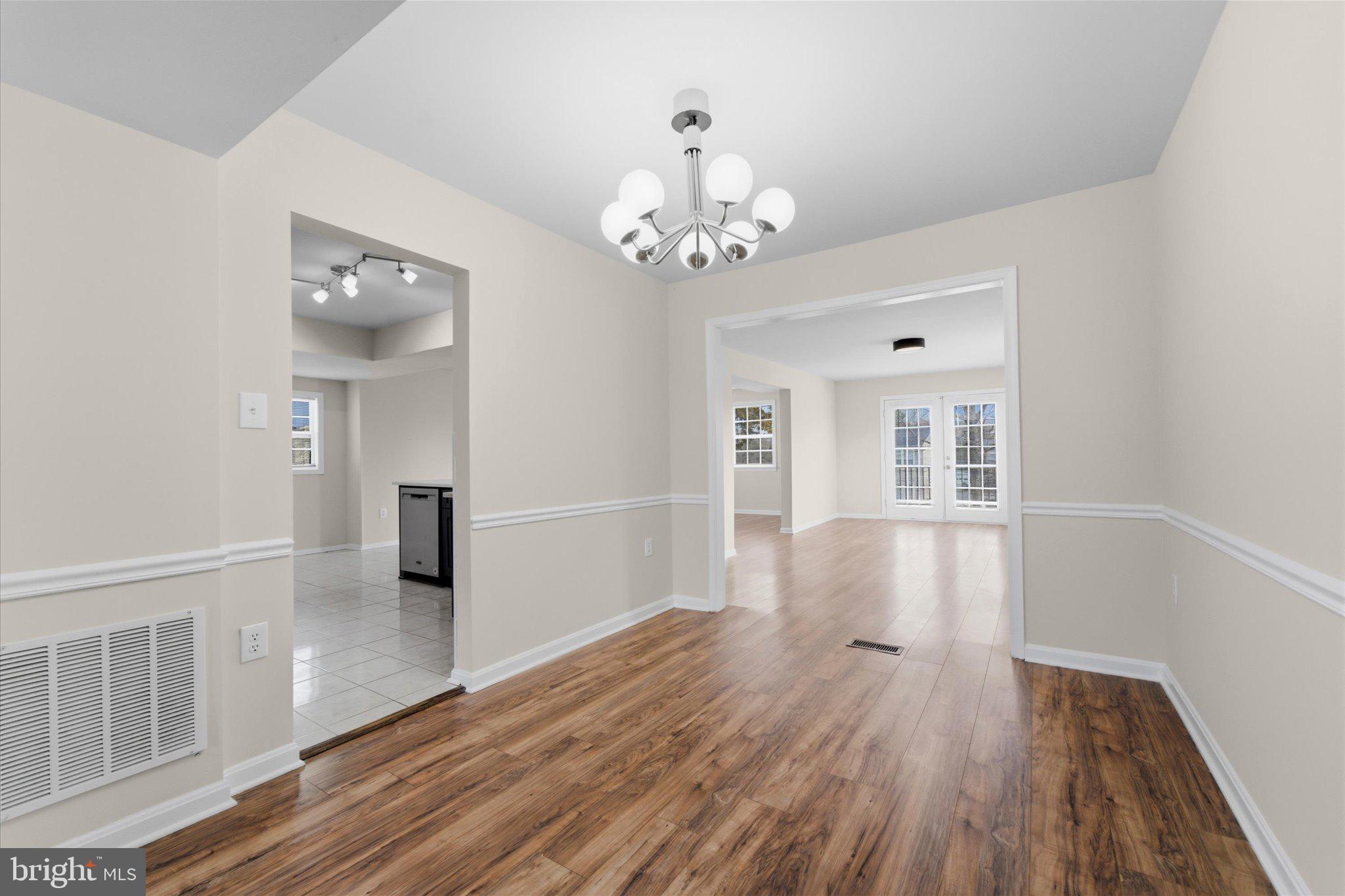 13511 Chevy Chase Court Chantilly, VA 20151 - Photo 7 of 57 a view of a livingroom with wooden floor