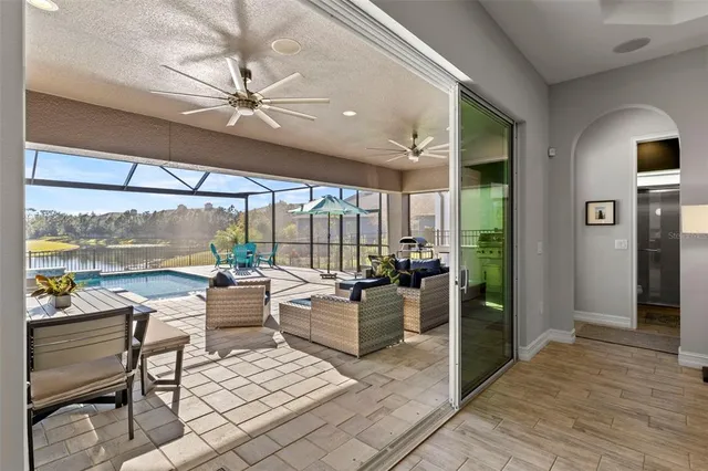 an aerial view of a houses with a swimming pool