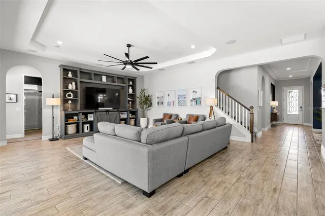 a kitchen with kitchen island granite countertop a sink a counter space appliances and cabinets