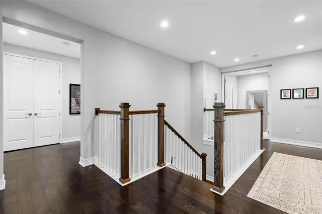 a bathroom with a granite countertop sink a toilet and a mirror