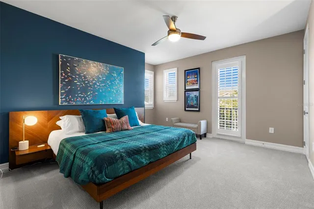 a spacious bedroom with a bed and a cabinets