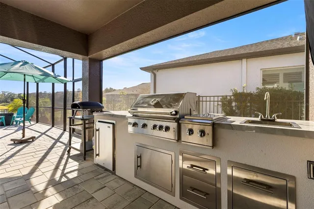 an aerial view of a houses with a swimming pool
