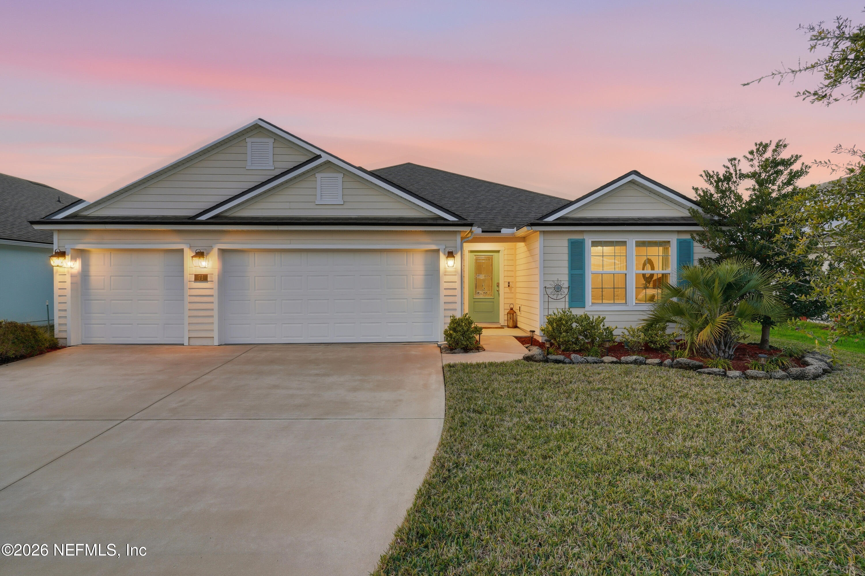 71 Gypsum Pl Street St. Augustine, FL 32086 - Photo 1 of 42 a front view of a house with a yard and garage