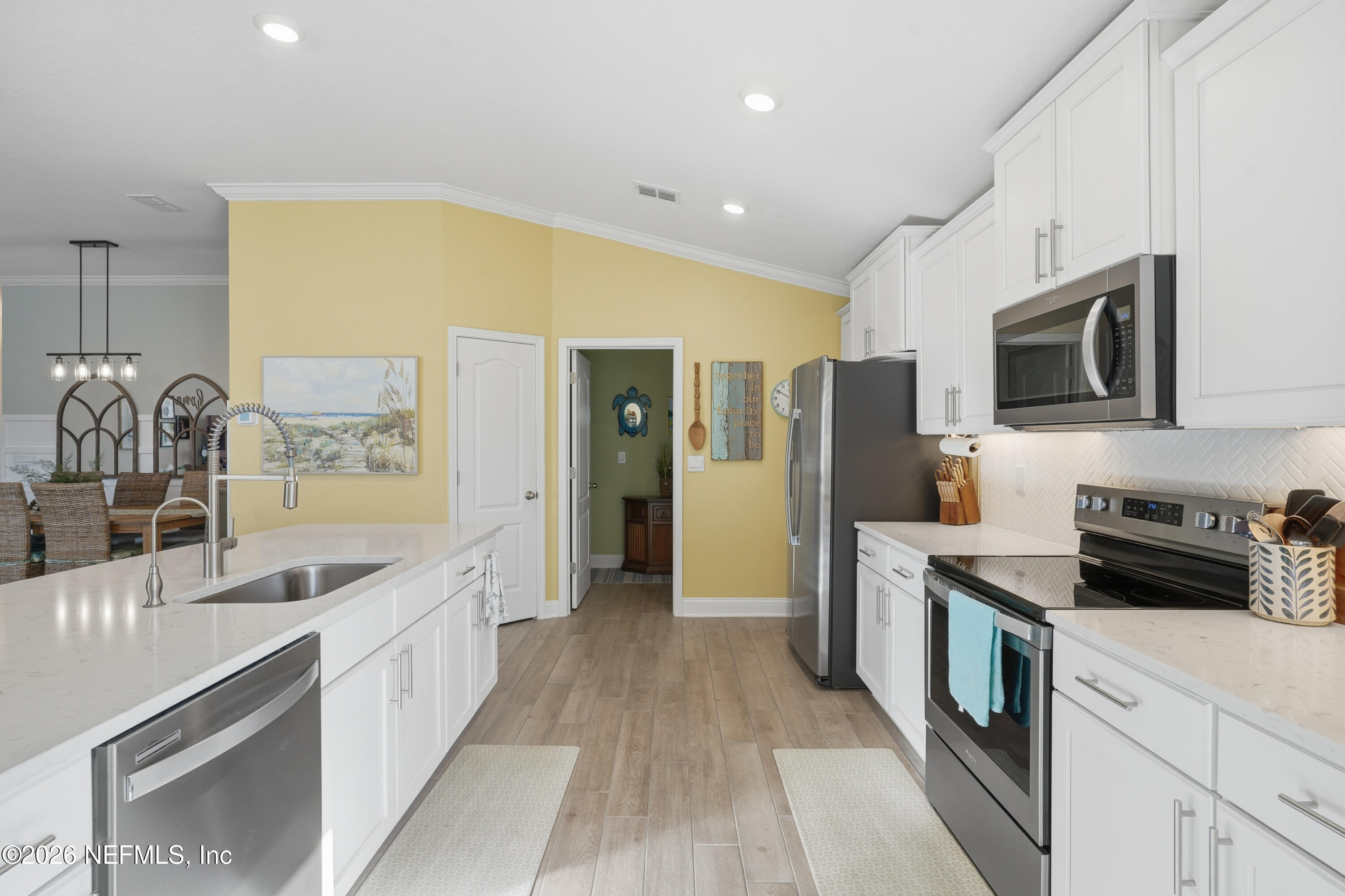 71 Gypsum Pl Street St. Augustine, FL 32086 - Photo 12 of 42 a kitchen with stainless steel appliances granite countertop a sink and cabinets