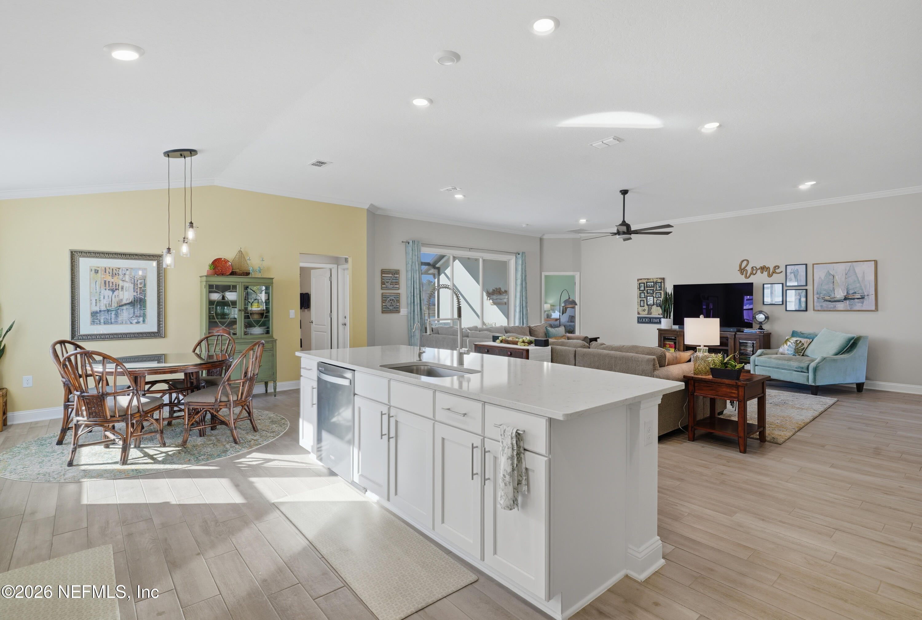 71 Gypsum Pl Street St. Augustine, FL 32086 - Photo 14 of 42 a large dining hall with stainless steel appliances granite countertop a stove and a couch