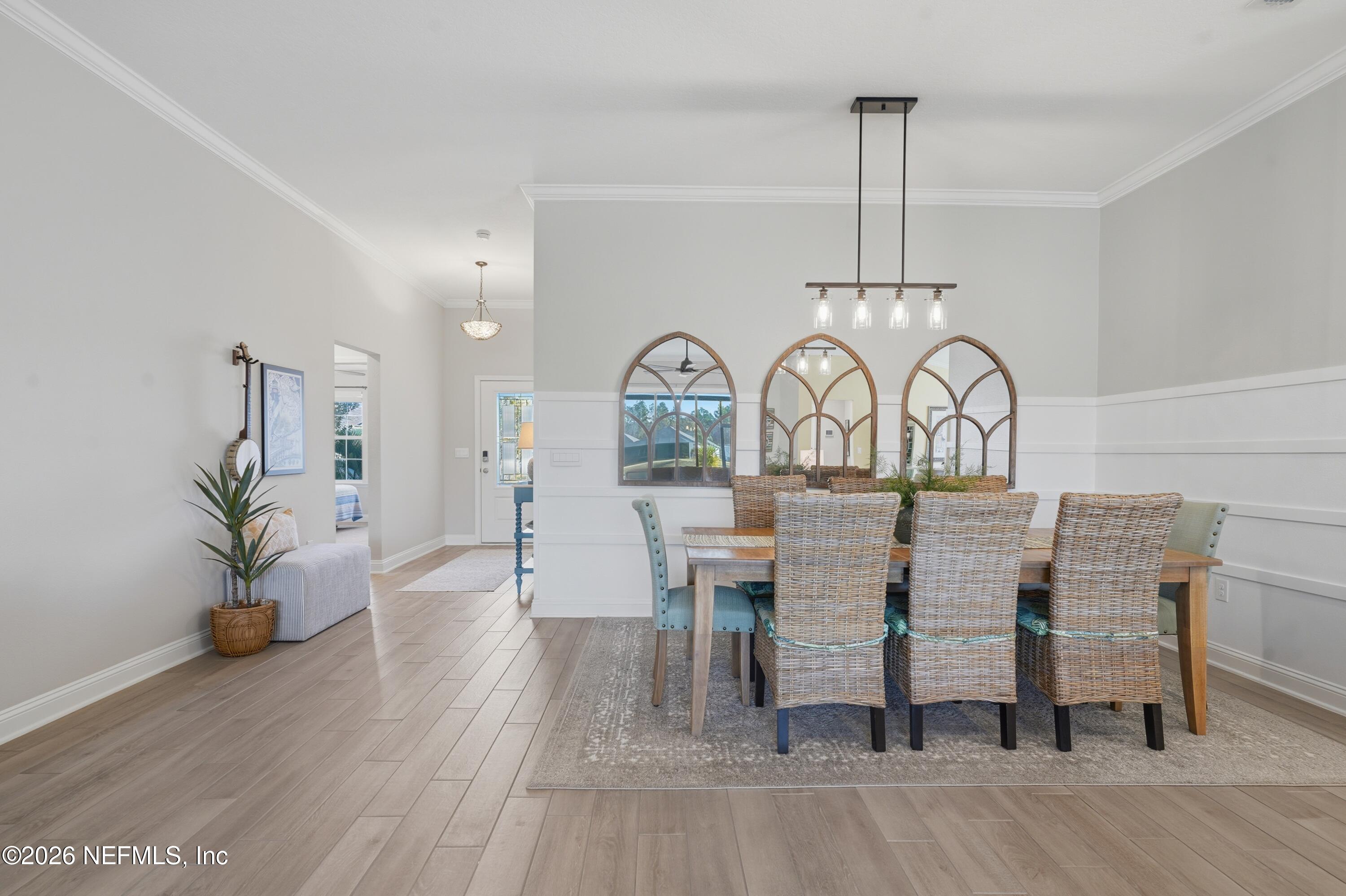 71 Gypsum Pl Street St. Augustine, FL 32086 - Photo 15 of 42 a view of a dining room with furniture window and wooden floor