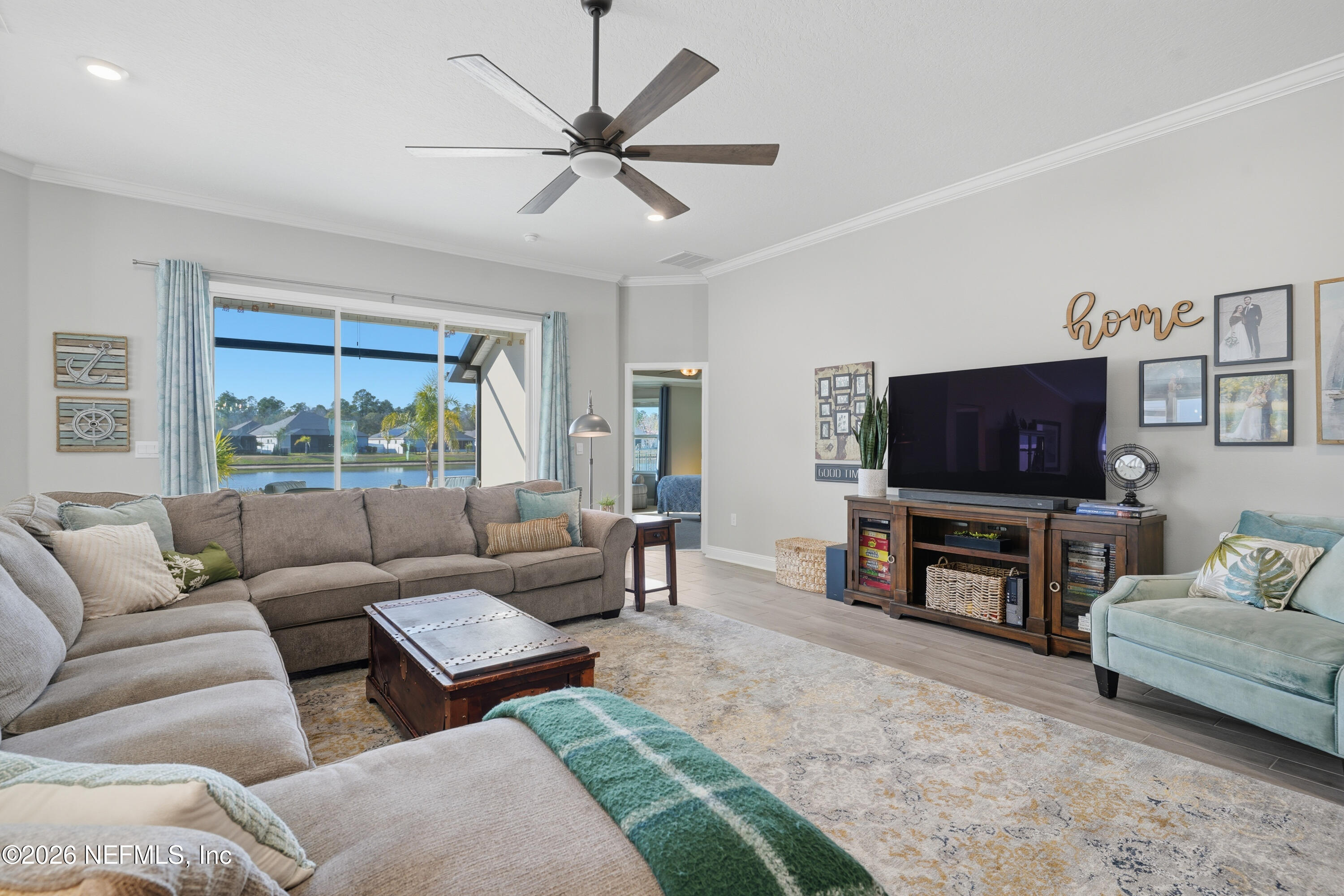 71 Gypsum Pl Street St. Augustine, FL 32086 - Photo 2 of 42 a living room with furniture and a flat screen tv