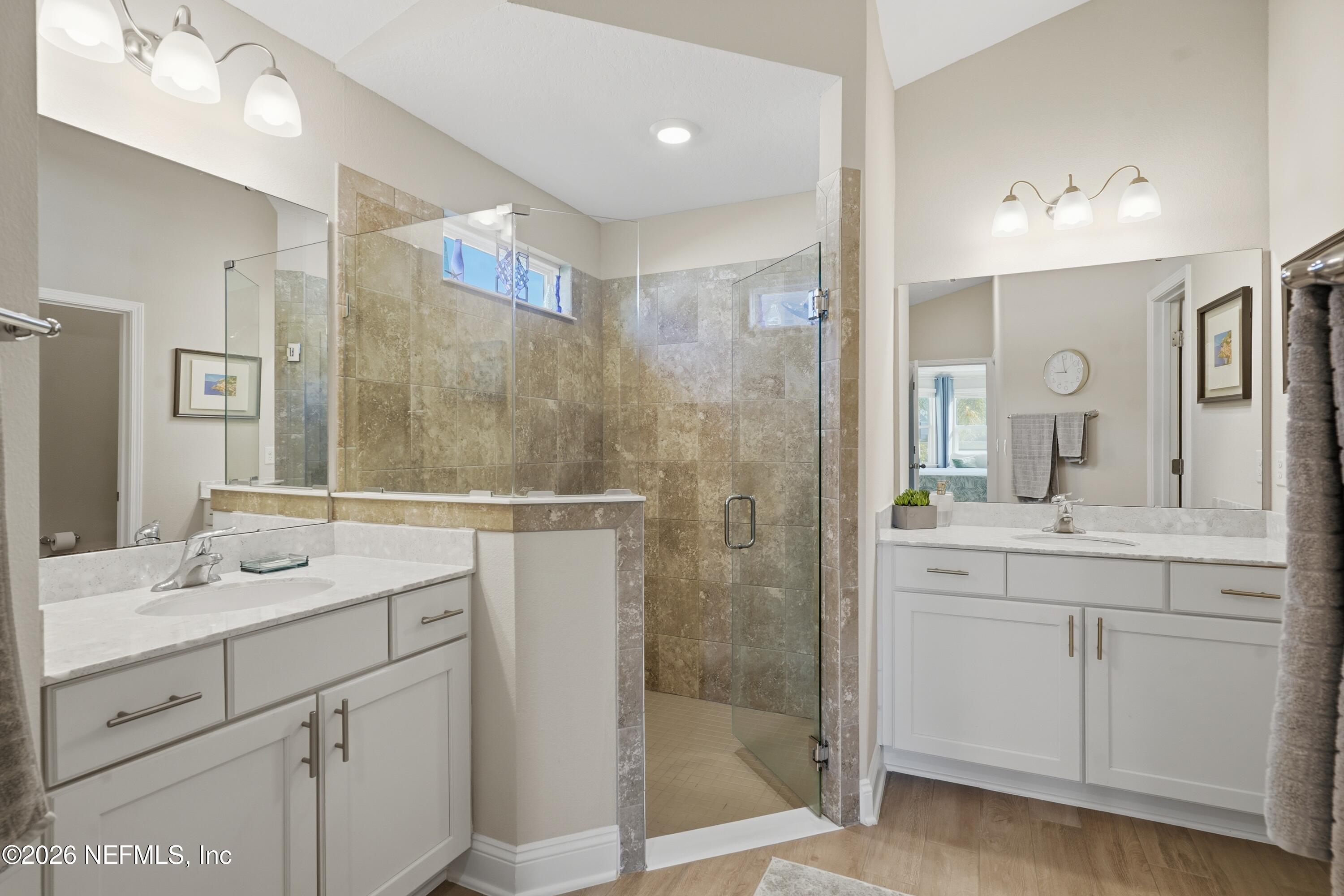 71 Gypsum Pl Street St. Augustine, FL 32086 - Photo 21 of 42 a bathroom with a shower sink and mirror