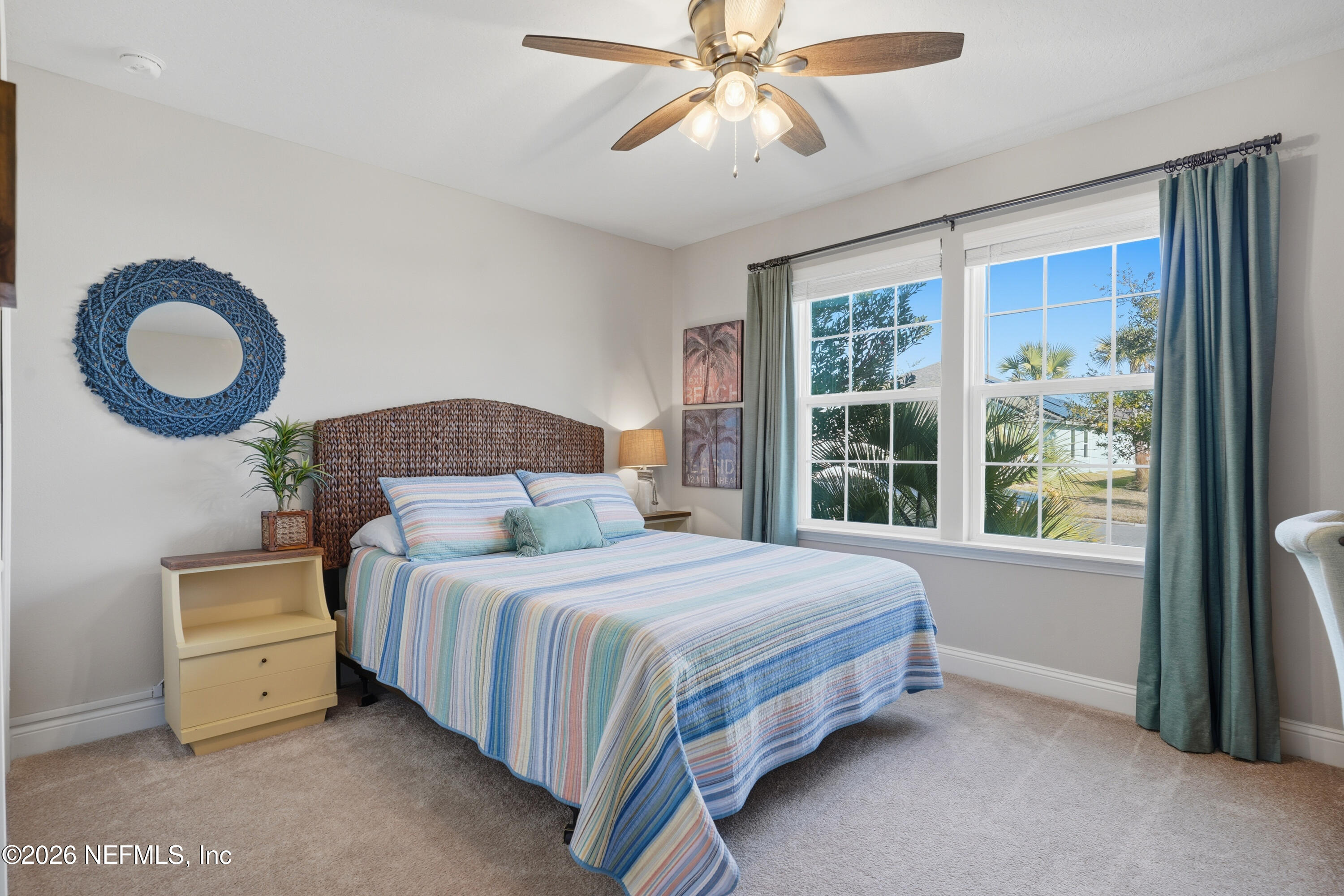 71 Gypsum Pl Street St. Augustine, FL 32086 - Photo 26 of 42 a bedroom with a bed and a large window