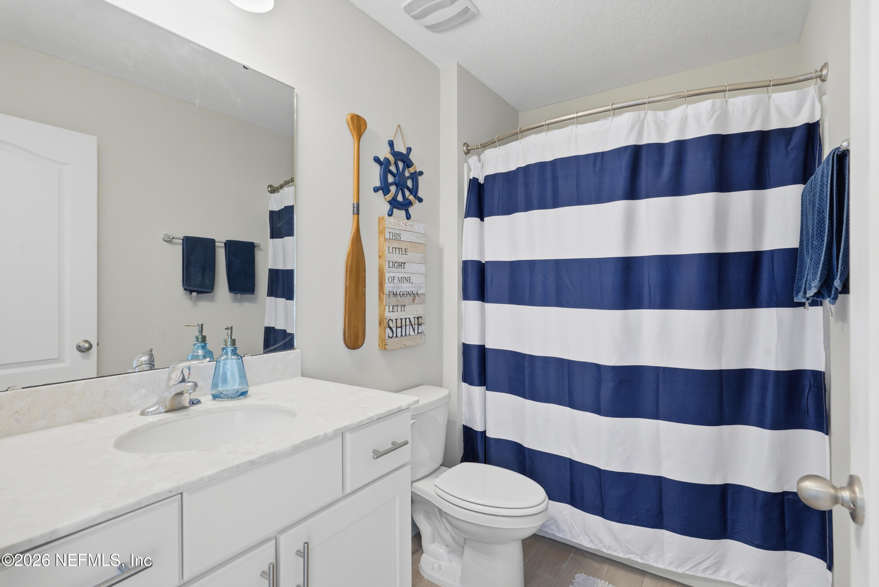 71 Gypsum Pl Street St. Augustine, FL 32086 - Photo 32 of 42 a bathroom with a sink and a mirror