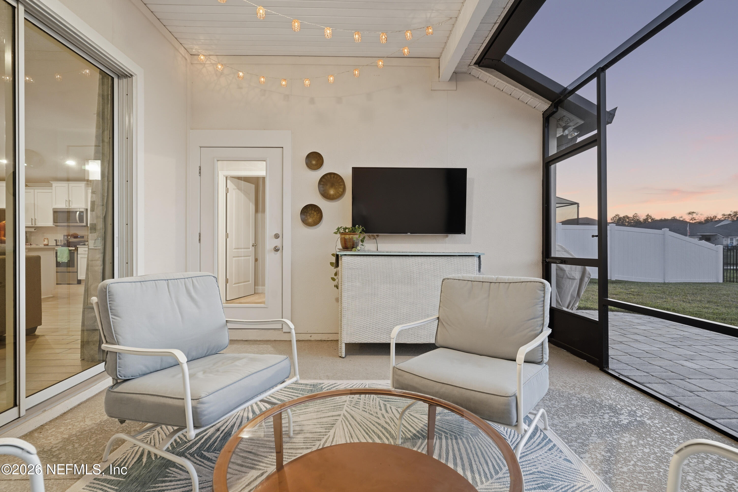71 Gypsum Pl Street St. Augustine, FL 32086 - Photo 34 of 42 a living room with furniture and a flat screen tv