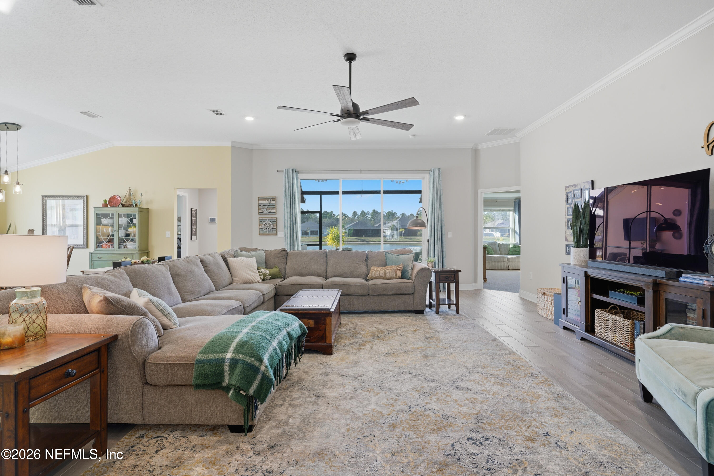 71 Gypsum Pl Street St. Augustine, FL 32086 - Photo 8 of 42 a living room with furniture and a flat screen tv