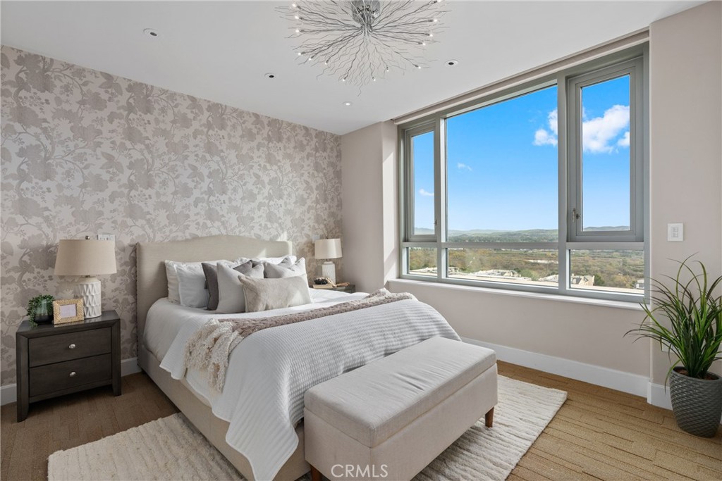 5153 Scholarship Irvine, CA 92612 - Photo 11 of 45 a bedroom with a large bed and a large window