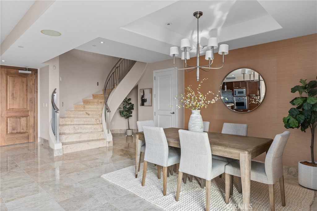 5153 Scholarship Irvine, CA 92612 - Photo 14 of 45 a view of a dining room with furniture and chandelier