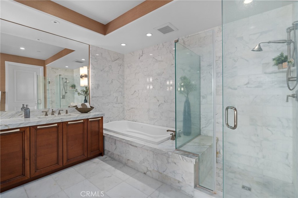 5153 Scholarship Irvine, CA 92612 - Photo 19 of 45 a bathroom with a bathtub shower sink and mirror