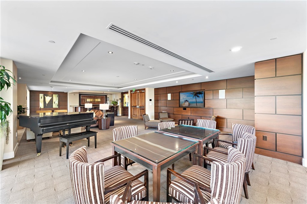 5153 Scholarship Irvine, CA 92612 - Photo 25 of 45 a living room with furniture a piano and a potted plant