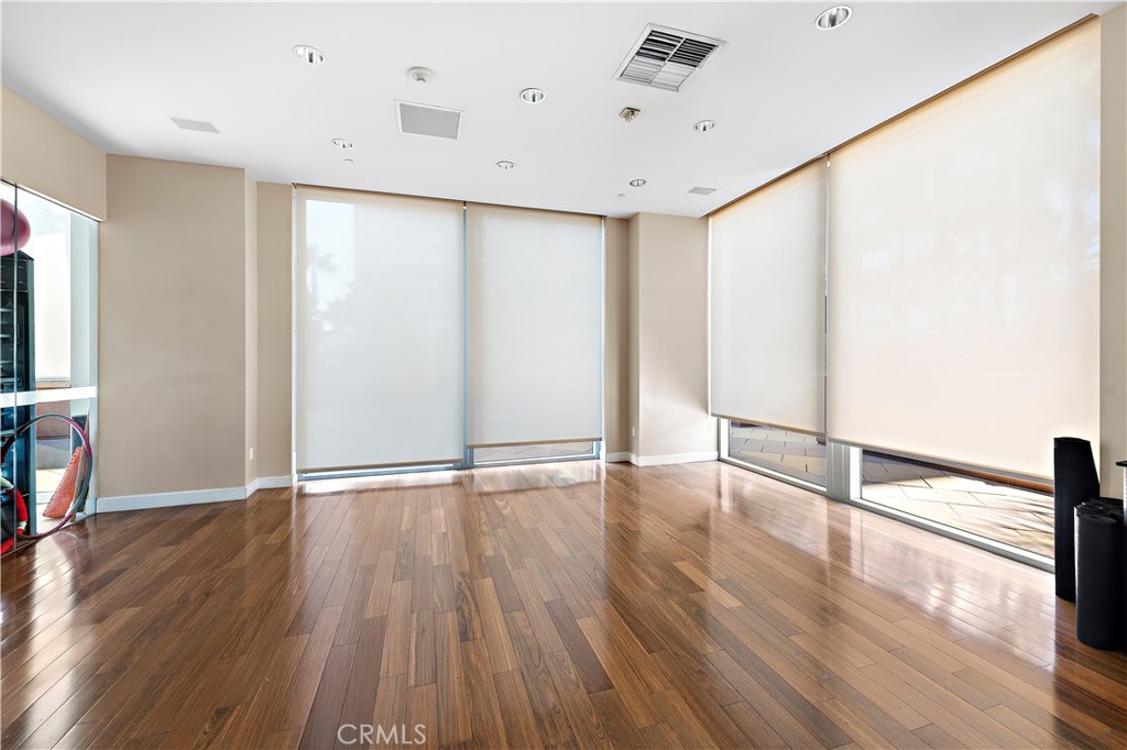 5153 Scholarship Irvine, CA 92612 - Photo 35 of 45 a view of an empty room with wooden floor