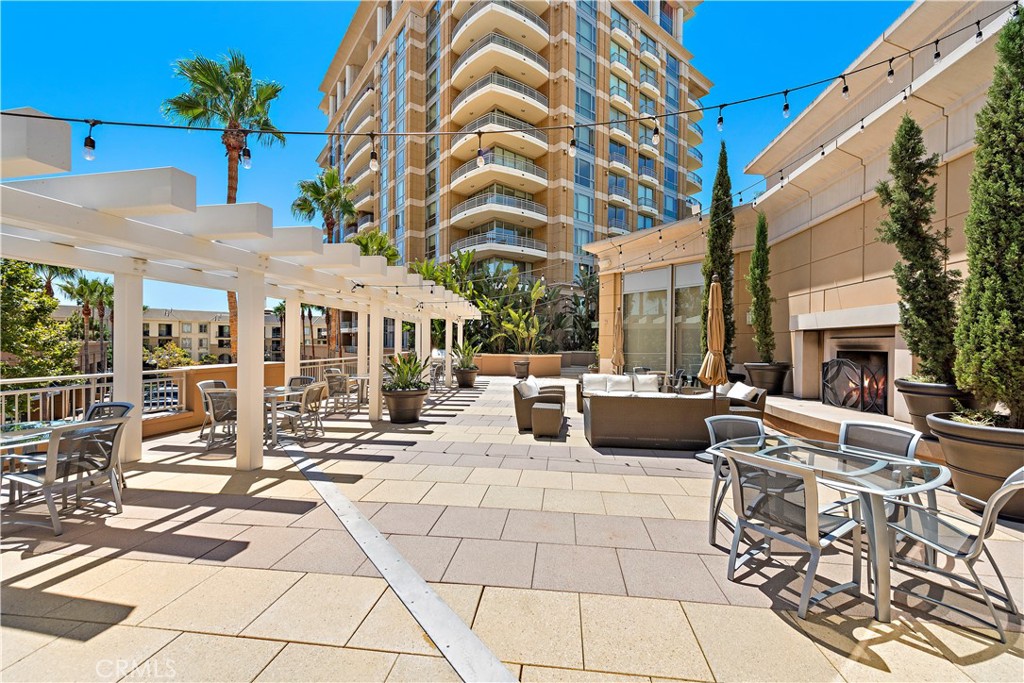 5153 Scholarship Irvine, CA 92612 - Photo 38 of 45 a view of a patio with couches table and chairs with potted plants