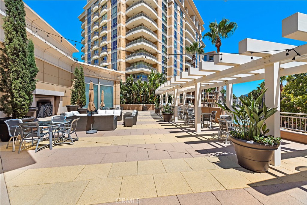 5153 Scholarship Irvine, CA 92612 - Photo 41 of 45 a view of a patio with dining table and chairs