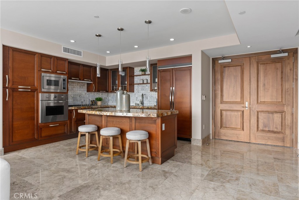 5153 Scholarship Irvine, CA 92612 - Photo 7 of 45 a large kitchen with a table and chairs