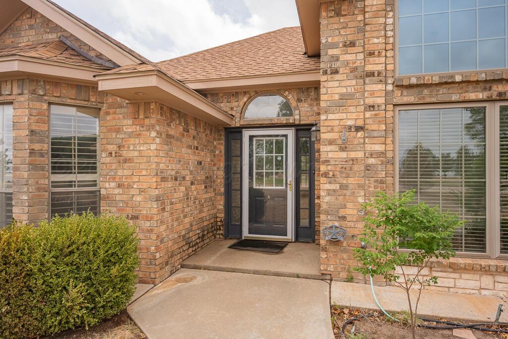 19933 Indian Spring Trail Bushland, TX 79124 - Photo 4 of 32 a front view of a house with a garden